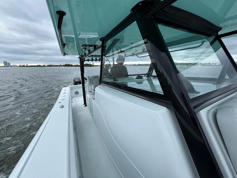 Slide: The Image of 2023 Yellowfin 42 Offshore boat cruising on a cloudy day. - 34