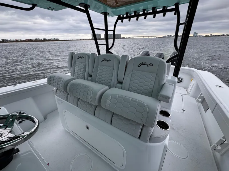Slide: The Image of 2023 Yellowfin 42 Offshore boat interior with luxurious seating and ocean view. - 43