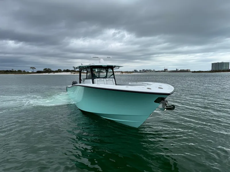 Slide: The Image of 2023 Yellowfin 42 Offshore boat cruising on a cloudy day. - 7