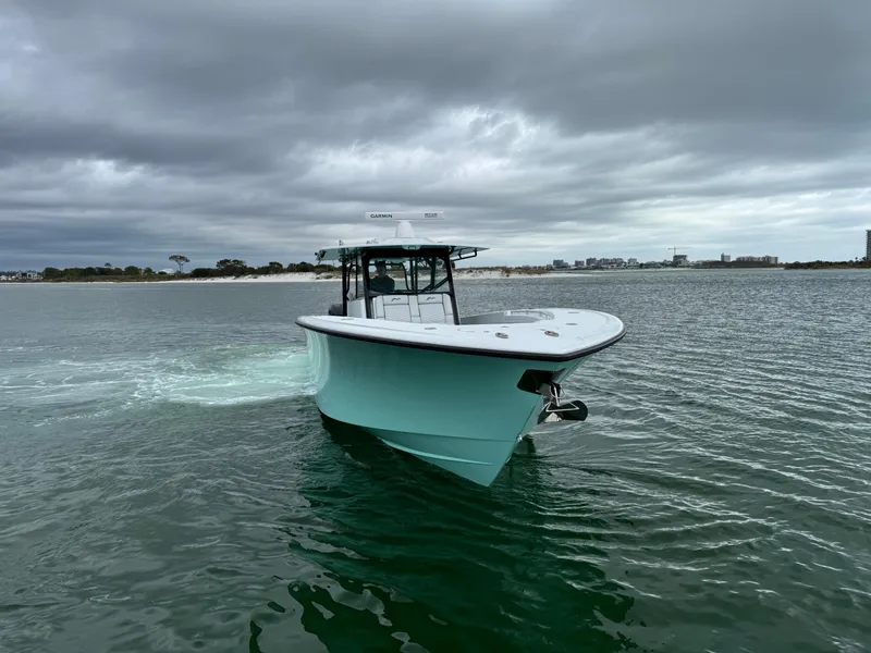 Slide: The Image of 2023 Yellowfin 42 Offshore boat cruising on a cloudy day. - 8