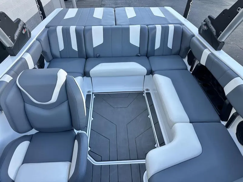 Slide: The Image of 2024 Malibu 21 LX-R boat interior with gray and white seating arrangement. - 10