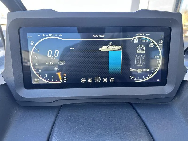 Slide: The Image of 2024 Malibu 21 LX-R dashboard display showing speedometer and boat controls. - 14