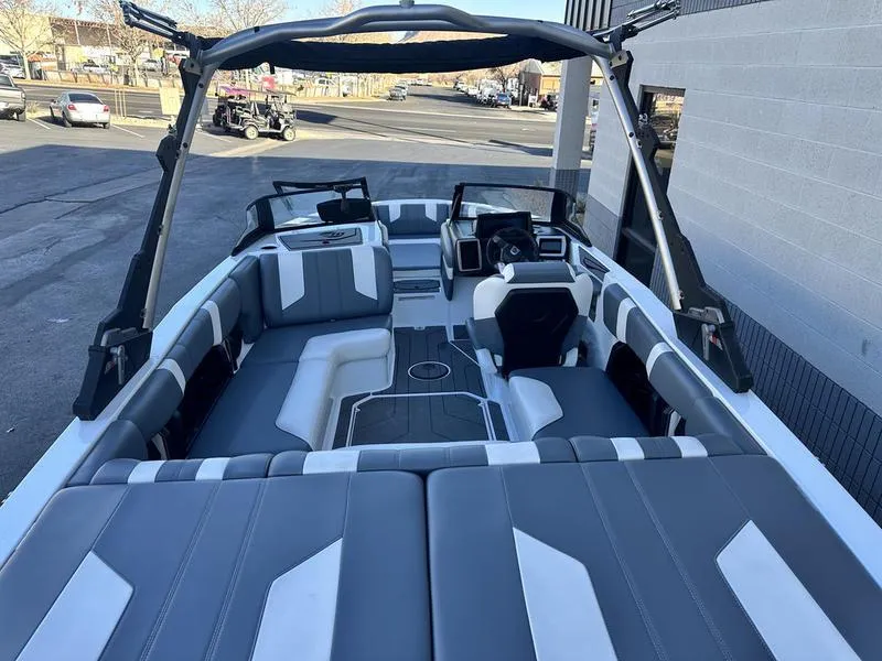 Slide: The Image of 2024 Malibu 21 LX-R boat interior with sleek gray and white seating design. - 8