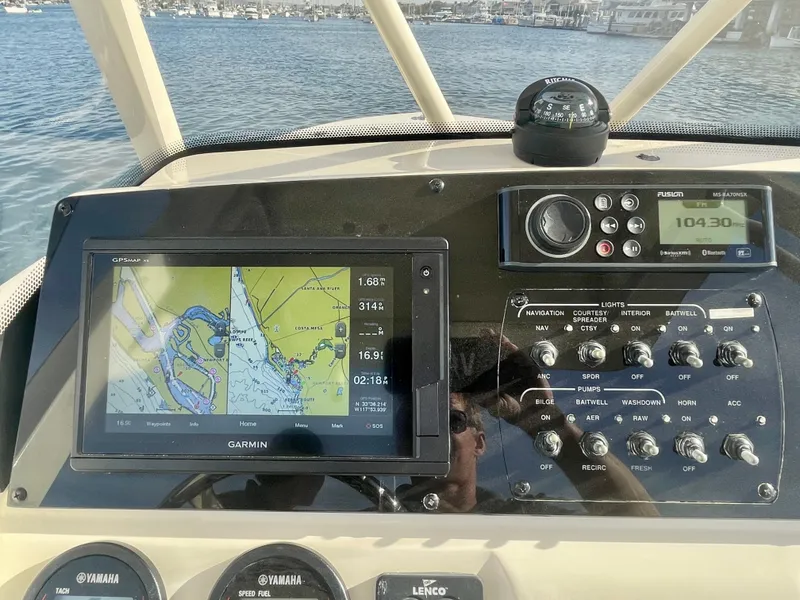 Slide: The Image of Control panel of 2020 Scout 215 XSF boat with Garmin navigation system. - 24
