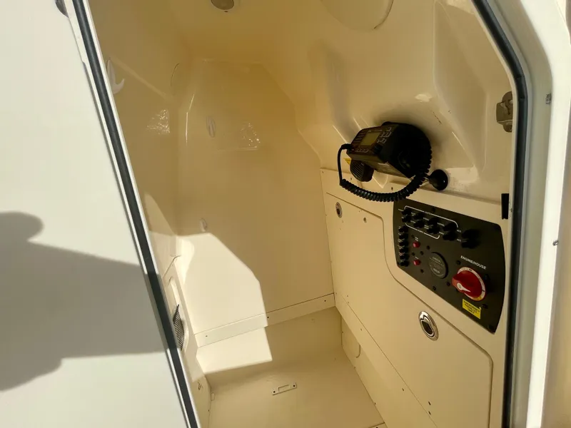 Slide: The Image of 2020 Scout 215 XSF boat interior with control panel and radio equipment. - 27