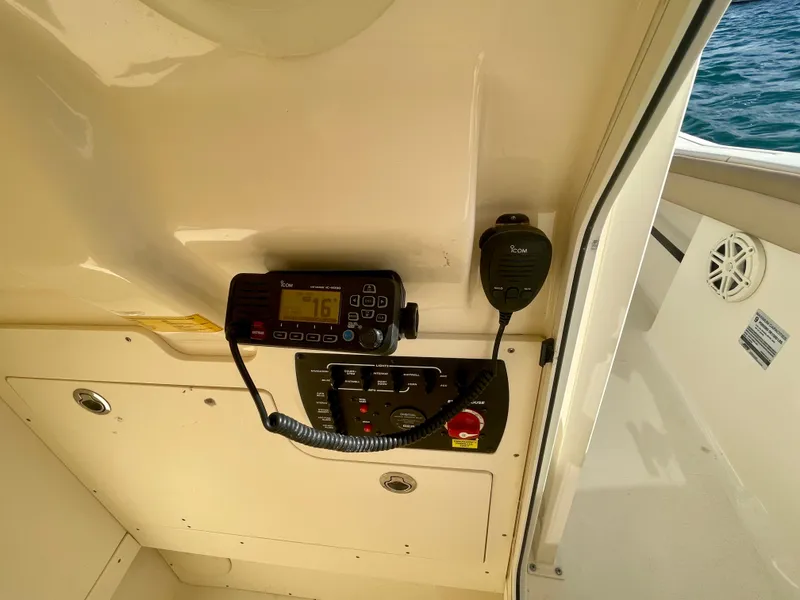 Slide: The Image of 2020 Scout 215 XSF boat interior with radio and control panel. - 28