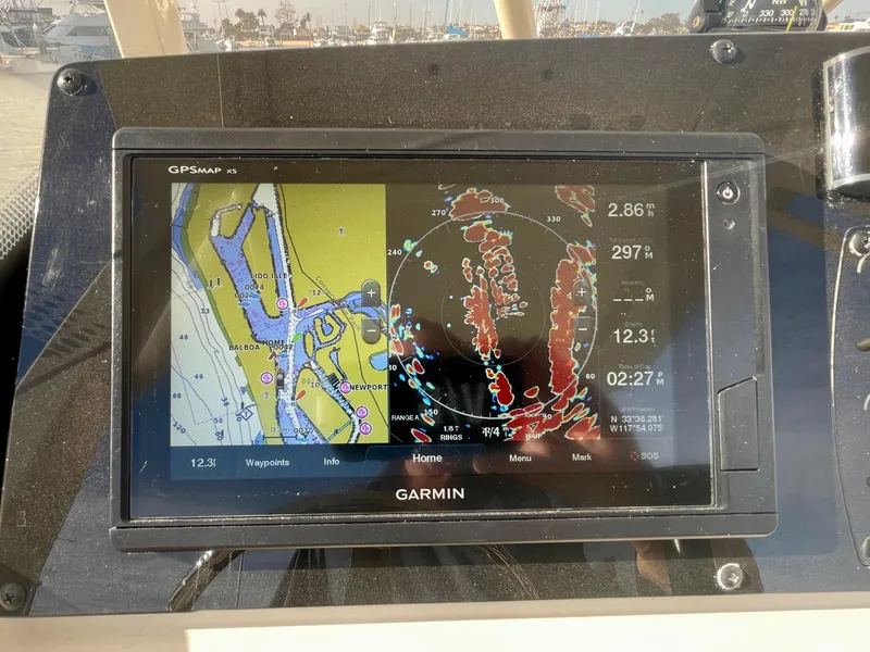 Slide: The Image of Garmin GPS display on 2020 Scout 215 XSF boat, showing navigation and radar data. - 37