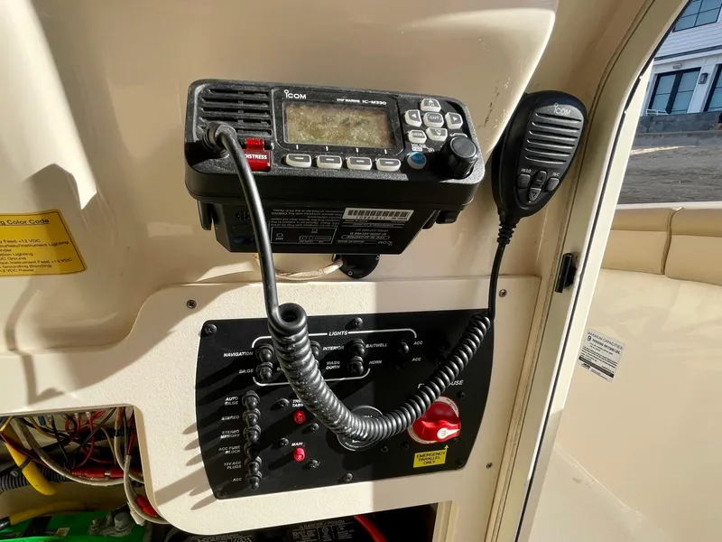 Slide: The Image of Control panel and radio equipment on a 2020 Scout 215 XSF boat. - 39