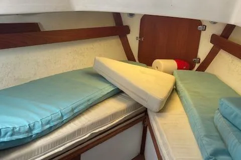 Slide: The Image of Interior cabin of a 1973 Tartan 34 sailboat with blue cushions. - 7