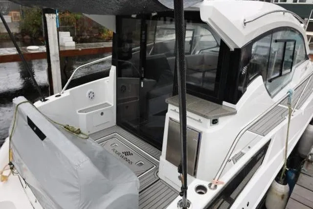 Slide: The Image of 2021 Four Winns V355 Coupe yacht docked, featuring sleek design and modern amenities. - 17