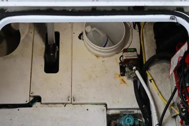 Slide: The Image of Engine compartment of 2021 Four Winns V355 Coupe with maintenance tools and equipment. - 47