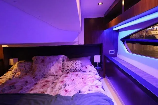 Slide: The Image of Luxurious cabin interior of 2021 Four Winns V355 Coupe with ambient lighting. - 69