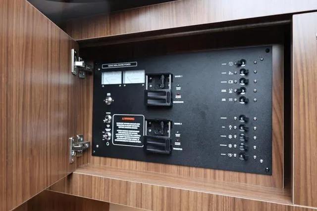 Slide: The Image of Electrical control panel inside 2021 Four Winns V355 Coupe yacht cabinet. - 72