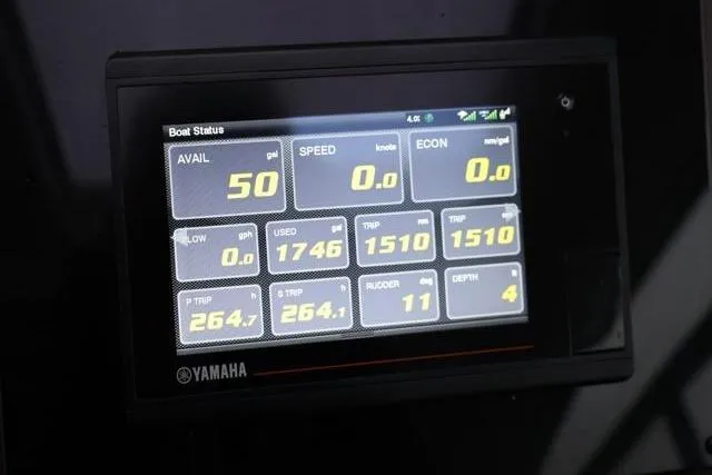 Slide: The Image of Yamaha boat status display showing fuel, speed, and trip data on a Four Winns V355 Coupe. - 79