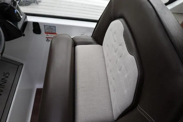 Slide: The Image of 2021 Four Winns V355 Coupe interior seat with brown and gray upholstery. - 84