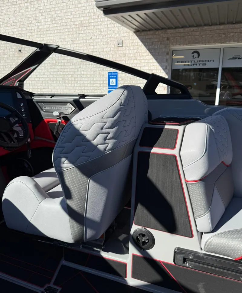Slide: The Image of 2025 Centurion Ri245 interior with modern gray seating and red accents. - 14