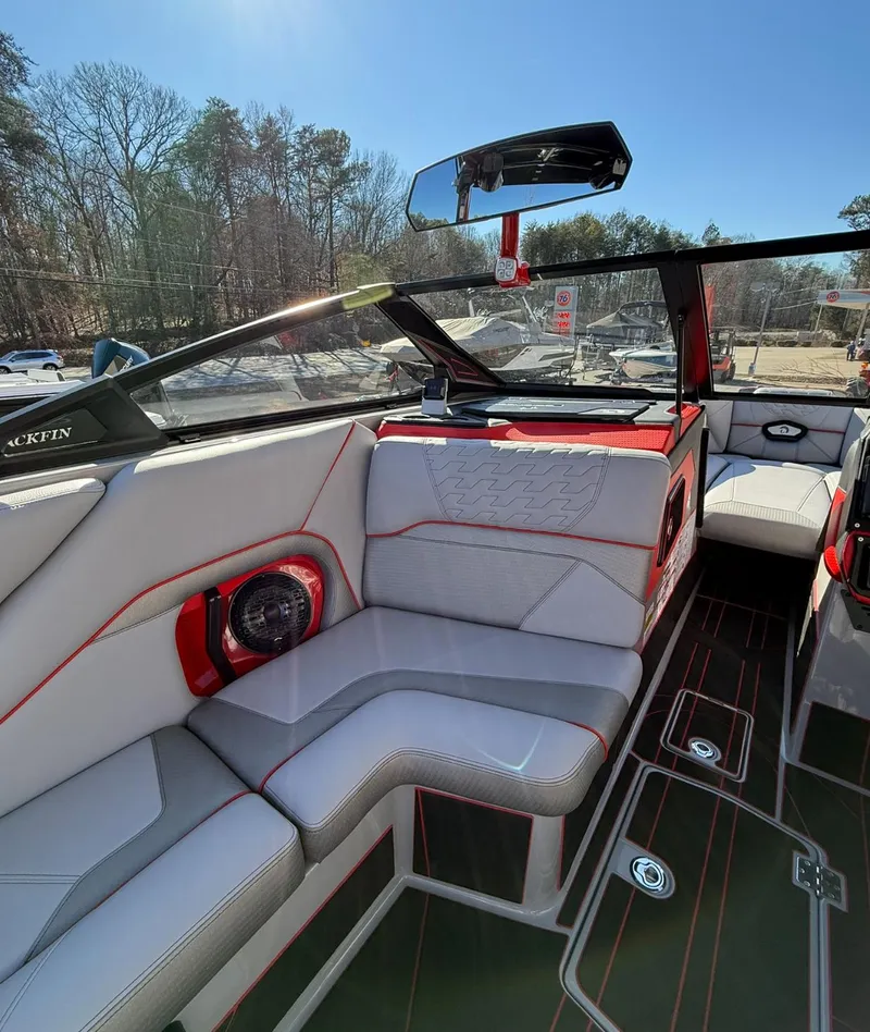Slide: The Image of 2025 Centurion Ri245 boat interior with sleek seating and modern design. - 22