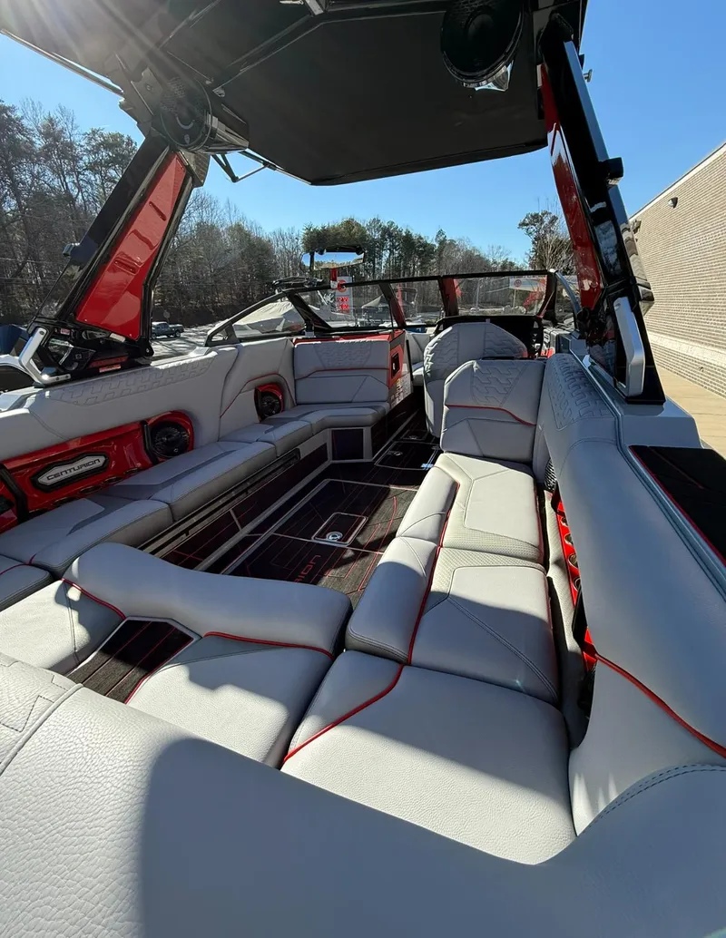 Slide: The Image of 2025 Centurion Ri245 boat interior with luxurious seating and modern design. - 25