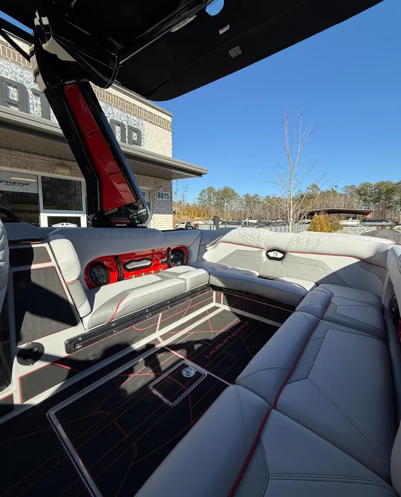 Slide: The Image of 2025 Centurion Ri245 boat interior with modern seating and sleek design. - 8