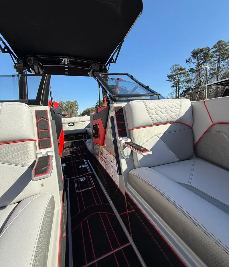 Slide: The Image of 2025 Centurion Ri245 boat interior with modern seating and sleek design. - 9