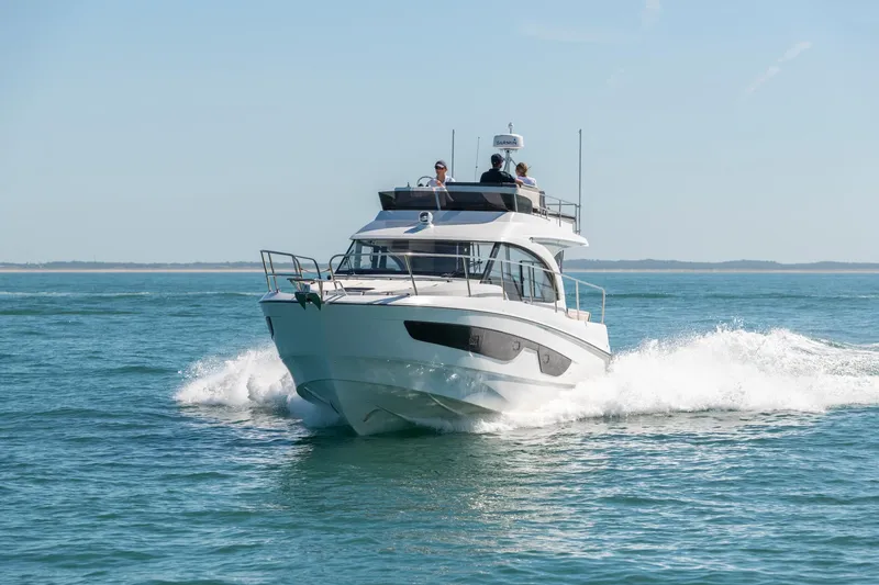 Slide: The Image of 2025 Beneteau Antares 11 Fly cruising on open water, showcasing sleek design and performance. - 26