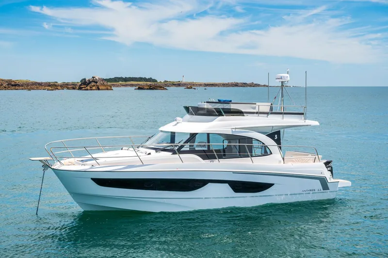 Slide: The Image of 2025 Beneteau Antares 11 Fly yacht on calm sea under blue sky. - 3