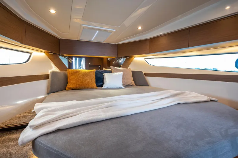 Slide: The Image of Luxurious cabin interior of 2025 Beneteau Antares 11 Fly with cozy bedding and ambient lighting. - 30