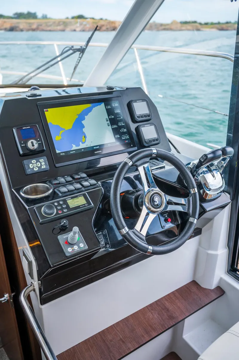 Slide: The Image of 2025 Beneteau Antares 11 Fly helm with navigation system and steering wheel. - 35