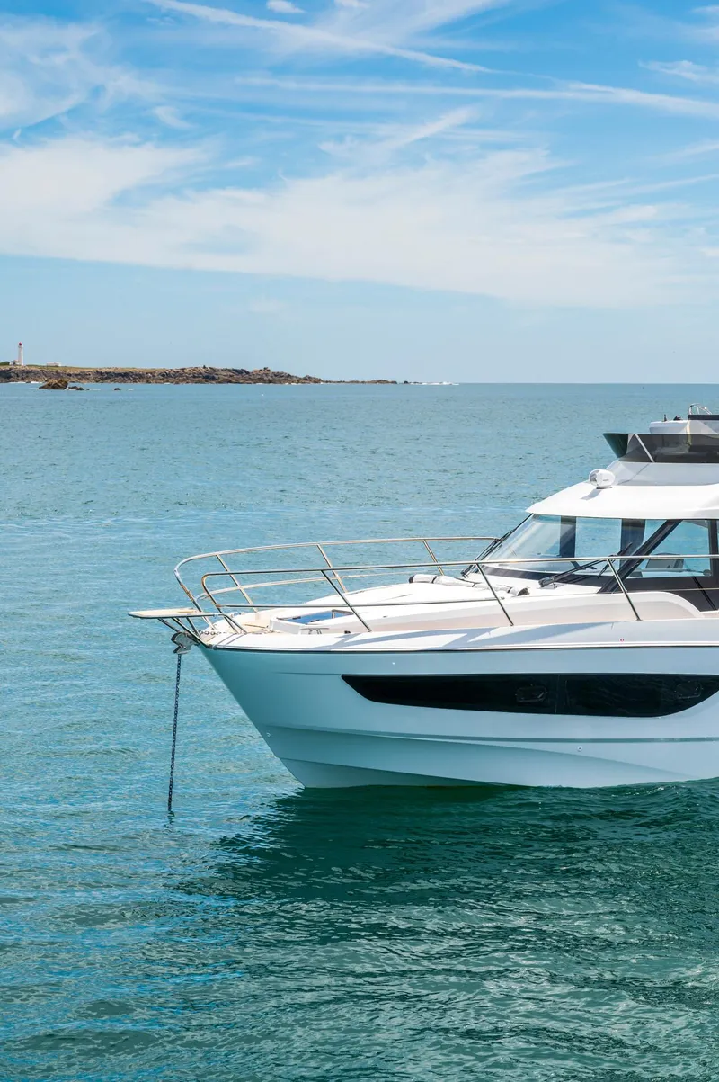 Slide: The Image of 2025 Beneteau Antares 11 Fly yacht on calm sea under blue sky. - 4