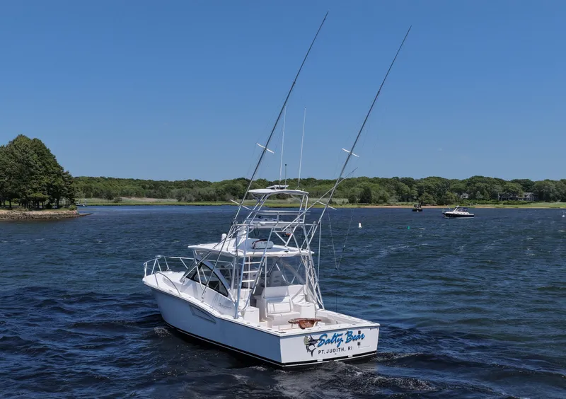 Slide: The Image of 2022 Albemarle 360 Express Fisherman boat on a scenic lake with clear blue skies. - 10