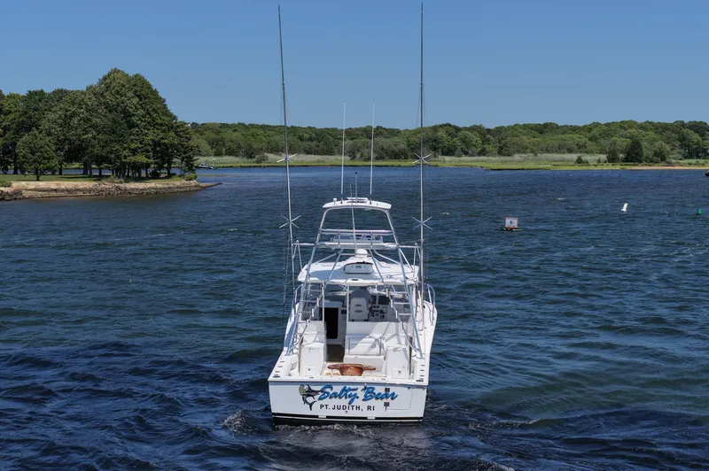 Slide: The Image of 2022 Albemarle 360 Express Fisherman boat on a scenic lake with lush green shoreline. - 12