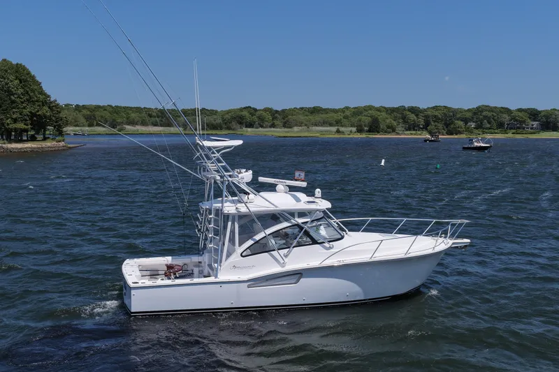 Slide: The Image of 2022 Albemarle 360 Express Fisherman boat on a sunny day, cruising in a scenic waterway. - 15