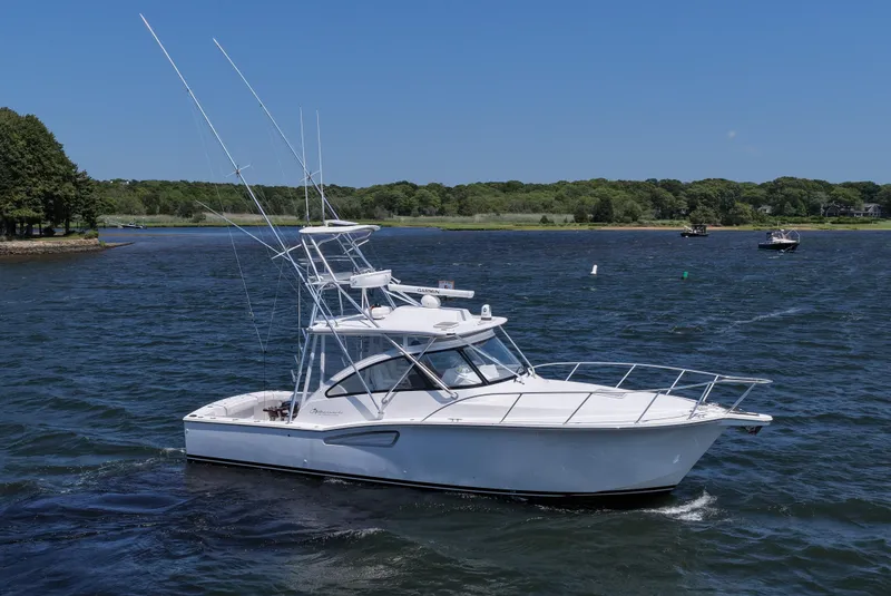 Slide: The Image of 2022 Albemarle 360 Express Fisherman boat on a scenic lake. - 16