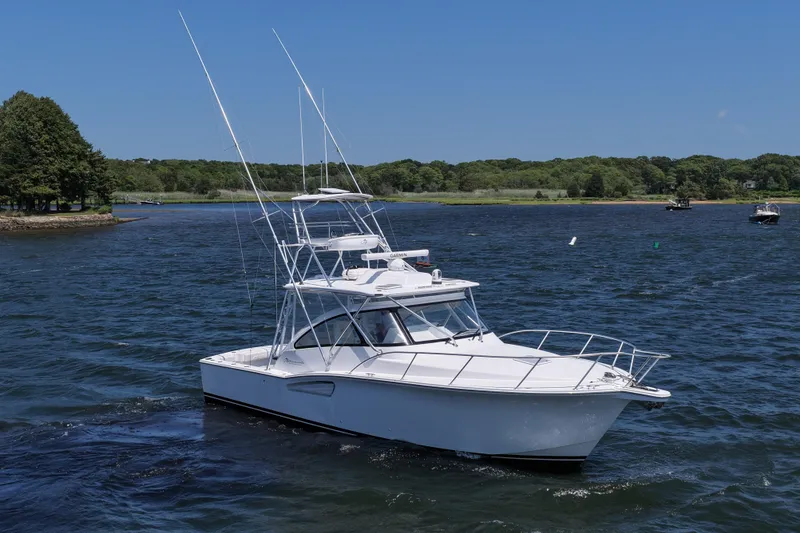 Slide: The Image of 2022 Albemarle 360 Express Fisherman boat cruising on a sunny day. - 2