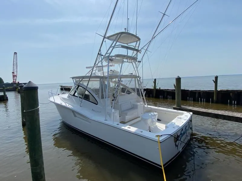 Slide: The Image of 2022 Albemarle 360 Express Fisherman boat docked by the water. - 21