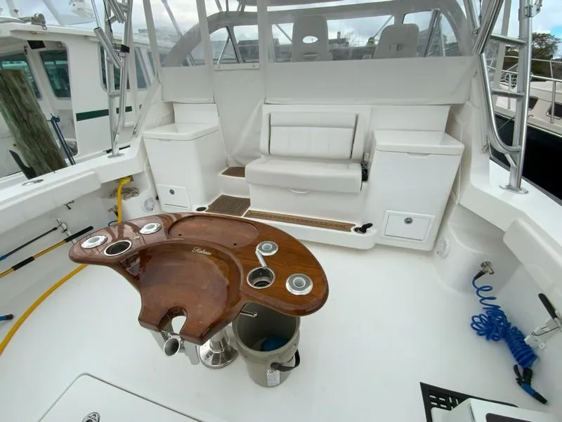 Slide: The Image of 2022 Albemarle 360 Express Fisherman boat interior with seating and fishing equipment. - 27