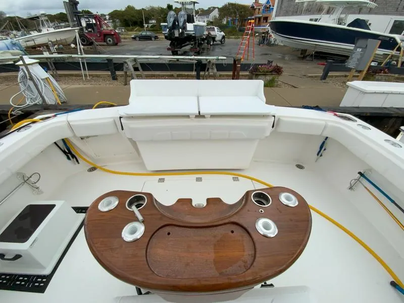 Slide: The Image of 2022 Albemarle 360 Express Fisherman boat deck with fishing rod holders and seating area. - 29