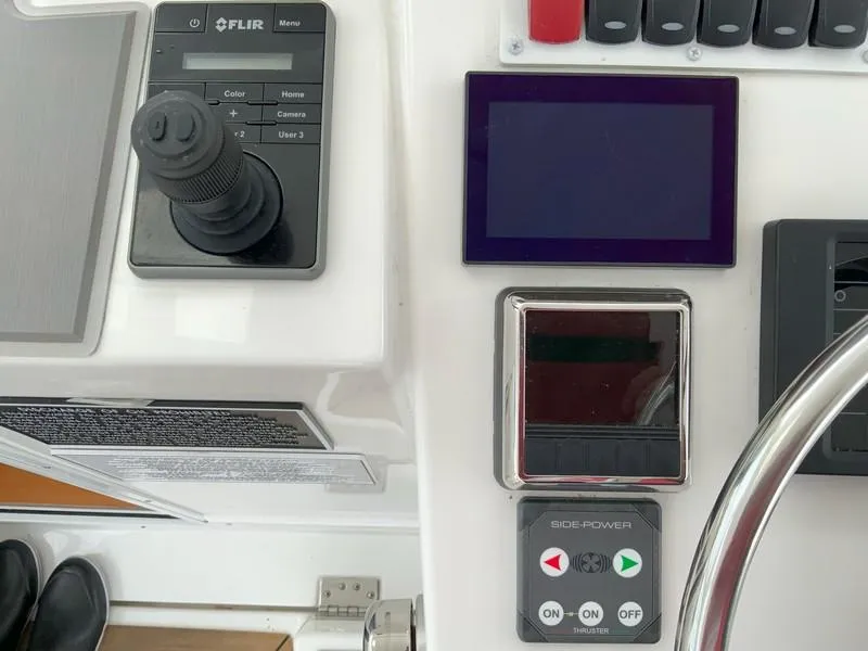 Slide: The Image of Control panel of 2022 Albemarle 360 Express Fisherman with joystick and display screens. - 33