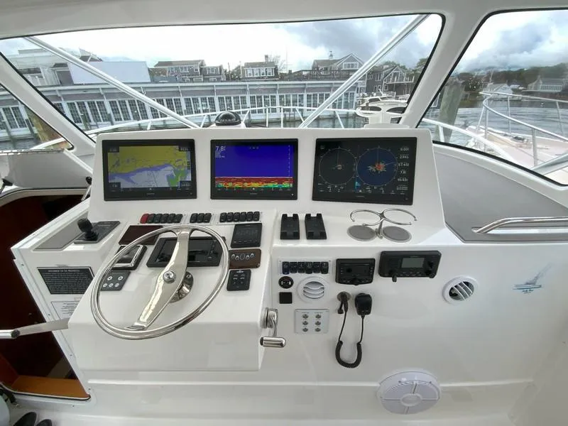 Slide: The Image of 2022 Albemarle 360 Express Fisherman helm with advanced navigation displays and controls. - 34