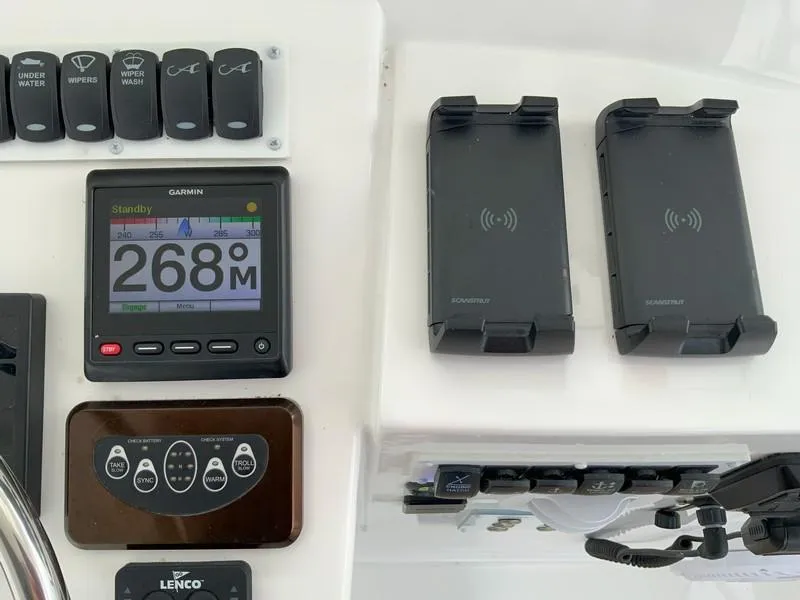 Slide: The Image of Control panel of 2022 Albemarle 360 Express Fisherman with Garmin display and wireless chargers. - 35