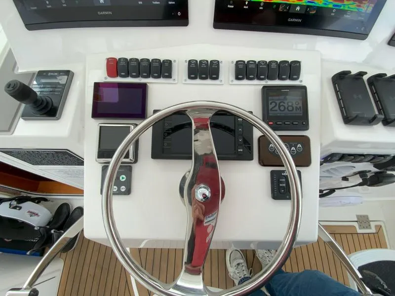 Slide: The Image of Control panel of 2022 Albemarle 360 Express Fisherman with steering wheel and navigation instruments. - 37