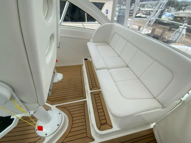 Slide: The Image of 2022 Albemarle 360 Express Fisherman interior with white seating and teak flooring. - 47