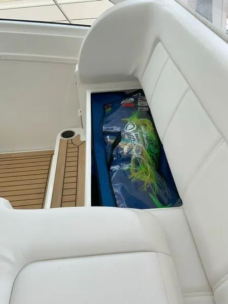 Slide: The Image of 2022 Albemarle 360 Express Fisherman boat interior with white seating and storage compartment. - 48