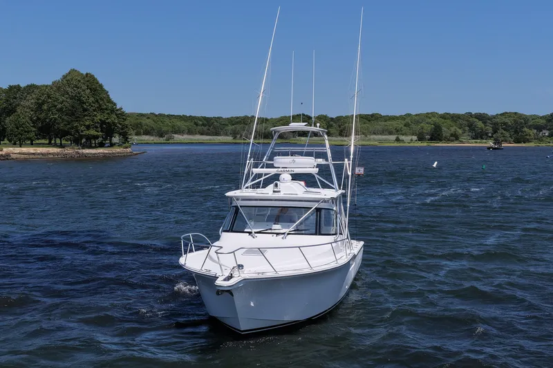 Slide: The Image of 2022 Albemarle 360 Express Fisherman boat cruising on a scenic lake. - 5