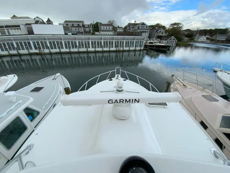 Slide: The Image of 2022 Albemarle 360 Express Fisherman docked, featuring Garmin equipment, with waterfront buildings in the background. - 51