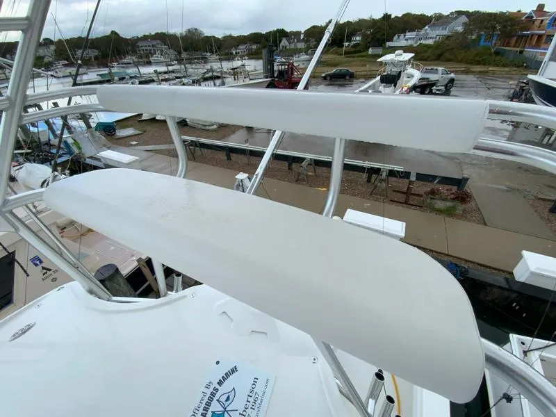 Slide: The Image of Albemarle 360 Express Fisherman 2022 boat, view of upper deck seating, marina background. - 55