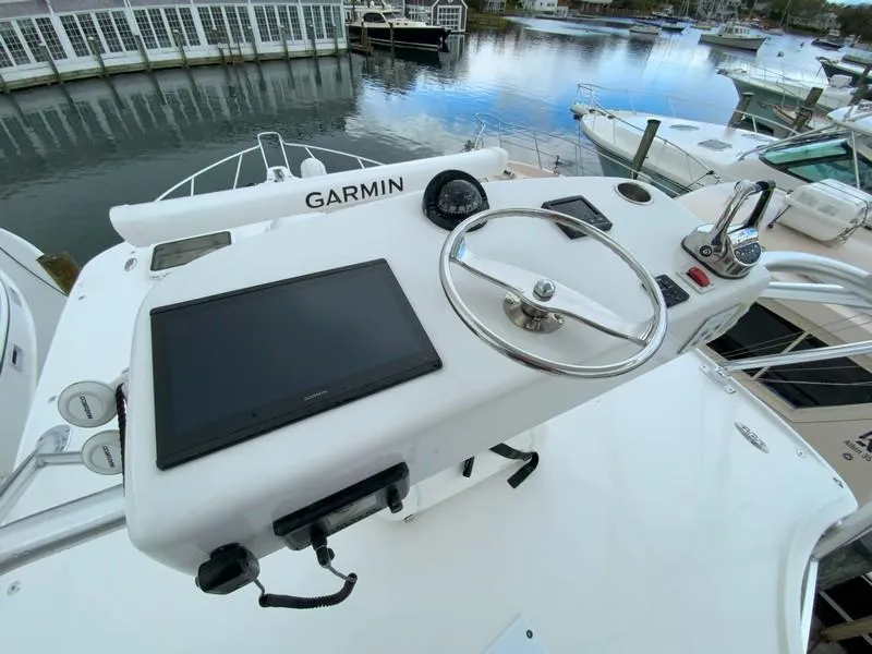 Slide: The Image of 2022 Albemarle 360 Express Fisherman helm with Garmin navigation system, docked at marina. - 57