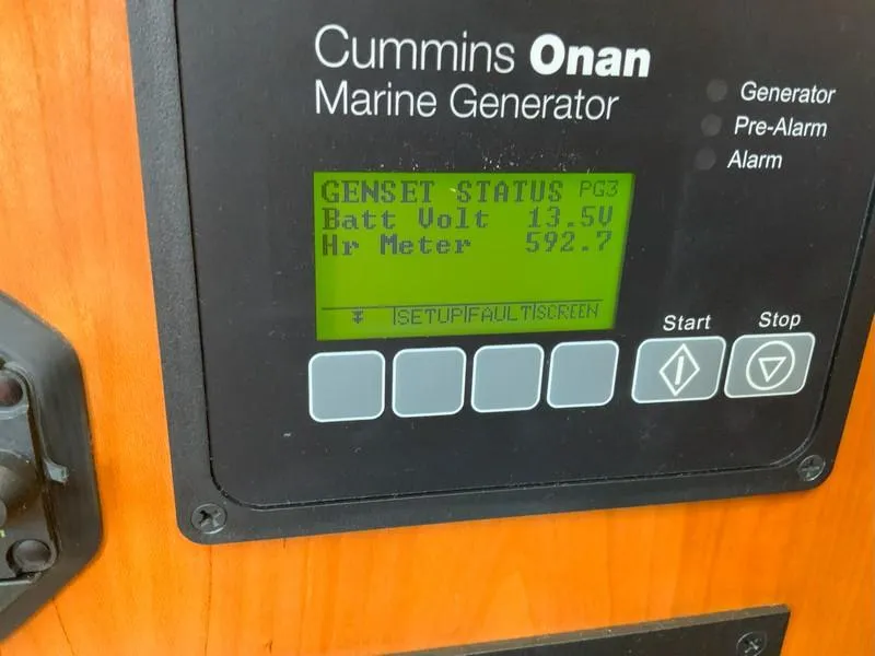 Slide: The Image of Control panel of Cummins Onan marine generator on 2022 Albemarle 360 Express Fisherman. - 60