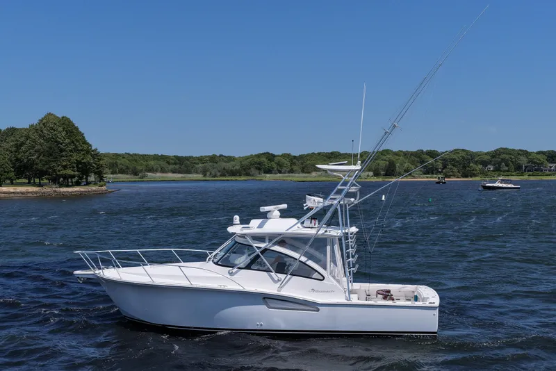 Slide: The Image of 2022 Albemarle 360 Express Fisherman boat on a scenic lake. - 8