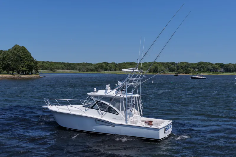 Slide: The Image of 2022 Albemarle 360 Express Fisherman boat cruising on a scenic lake. - 9